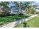 Charming two-story home with well-manicured lawn and mature trees at 15604 Deerglen Dr, Tampa, FL 33624