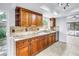 Kitchen featuring wood cabinetry, granite countertops, and stainless steel appliances at 15604 Deerglen Dr, Tampa, FL 33624
