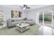 Modern living room with stylish furnishings and a sliding glass door to the backyard at 15604 Deerglen Dr, Tampa, FL 33624