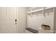 Entrance features a coat rack, storage, and easy access to the front door at 17015 Coral Key Dr, Nokomis, FL 34275