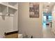 Hallway features convenient coat rack, storage, and access to the living area at 17015 Coral Key Dr, Nokomis, FL 34275