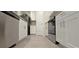 Clean kitchen with stainless steel appliances, white cabinetry, and wood-look floors at 17015 Coral Key Dr, Nokomis, FL 34275