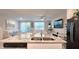 Bright kitchen with a large island, granite countertops, and stainless steel appliances at 17015 Coral Key Dr, Nokomis, FL 34275