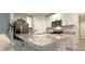 Kitchen features granite countertops, stainless steel appliances, and white cabinetry at 17015 Coral Key Dr, Nokomis, FL 34275