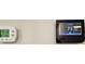 A smart thermostat shows an outside temperature of 85 degrees and indicates that a software update is available at 17015 Coral Key Dr, Nokomis, FL 34275