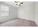Neutral bedroom with carpet and ceiling fan showcasing a serene space at 17618 Cortes Creek Blvd, Spring Hill, FL 34610