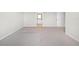 View of a large bedroom with neutral carpet, paint and ensuite bathroom access at 17618 Cortes Creek Blvd, Spring Hill, FL 34610