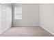 Carpeted bedroom featuring a closet with paneled double doors at 17618 Cortes Creek Blvd, Spring Hill, FL 34610