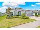 Charming single-Gathering home with a well-manicured lawn, mature landscaping, and a two-car garage at 17618 Cortes Creek Blvd, Spring Hill, FL 34610