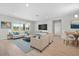Inviting living room with stylish furnishings, wood-look tile floors, and ample natural light, ideal for Gathering gatherings at 17618 Cortes Creek Blvd, Spring Hill, FL 34610