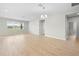 Bright and airy living area features wood-look tile flooring, neutral walls, and natural light at 17618 Cortes Creek Blvd, Spring Hill, FL 34610