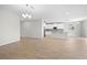 Open-concept living space features ceramic floors, recessed lighting, and an adjacent kitchen with modern appliances at 17618 Cortes Creek Blvd, Spring Hill, FL 34610
