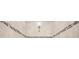 Shower features sand colored tile walls, mosaic accent tile, tile flooring and a brass shower head at 17618 Cortes Creek Blvd, Spring Hill, FL 34610