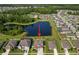 Aerial shot showcases the property's location within the community, backing up to the beautiful pond at 18428 Malinche Loop, Spring Hill, FL 34610
