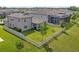 A spacious backyard featuring green grass, a white fence, and a covered patio area at 18428 Malinche Loop, Spring Hill, FL 34610