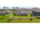 Large, green backyard enclosed by a white fence, providing privacy and space for outdoor activities at 18428 Malinche Loop, Spring Hill, FL 34610