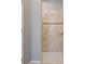 Bathroom showcasing a tiled shower with glass doors and a neutral color palette at 18428 Malinche Loop, Spring Hill, FL 34610
