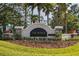 Welcoming entrance to Talavera community with lush landscaping and elegant signage at 18428 Malinche Loop, Spring Hill, FL 34610