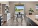 Cozy dining area with views of the lake, creating a perfect spot for casual meals at 18428 Malinche Loop, Spring Hill, FL 34610