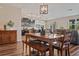 Dining room area highlighting wood flooring, wood furnishings, and ample space for entertaining at 18428 Malinche Loop, Spring Hill, FL 34610