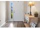Inviting entryway with a wood-look floors, and a console table with decorative accents at 18428 Malinche Loop, Spring Hill, FL 34610