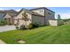 Exterior view of home features a well-kept lawn and a fenced-in area on the side of the house at 18428 Malinche Loop, Spring Hill, FL 34610