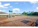 Well-maintained community playground with slides, swings, and a soft landing surface for safety at 18428 Malinche Loop, Spring Hill, FL 34610