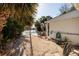 Backyard featuring a pool, tropical plants, and ample space for outdoor relaxation and entertainment at 1857 Bayou Grande Ne Blvd, St Petersburg, FL 33703