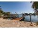 Waterfront home featuring a private boat dock and lift, offering convenient access to the open water at 1857 Bayou Grande Ne Blvd, St Petersburg, FL 33703