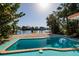 Waterfront property with a beautiful pool and dock, perfect for relaxation and enjoying waterfront living at 1857 Bayou Grande Ne Blvd, St Petersburg, FL 33703