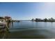 Scenic water view showcasing nearby houses, docks, and boats on a serene and sunny day at 1857 Bayou Grande Ne Blvd, St Petersburg, FL 33703