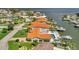 Aerial of waterfront homes with docks and boat access, showing luxurious coastal living at 1901 Kansas Ne Ave, St Petersburg, FL 33703