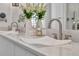 Beautiful bathroom vanity featuring double vessel sinks, modern fixtures, and marble-look countertop at 1901 Kansas Ne Ave, St Petersburg, FL 33703