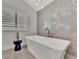 Relaxing bathtub with wall tile and modern fixtures; perfect for unwinding after a long day at 1901 Kansas Ne Ave, St Petersburg, FL 33703