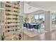 Dining area features wine storage, modern lighting, and views of the waterfront at 1901 Kansas Ne Ave, St Petersburg, FL 33703
