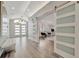Bright foyer with hardwood floors and sliding barn doors to the living area provides an open concept feel at 1901 Kansas Ne Ave, St Petersburg, FL 33703