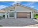 Charming single-story home with a terracotta roof, paver driveway, and beautifully landscaped grounds at 1901 Kansas Ne Ave, St Petersburg, FL 33703