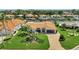 Well-manicured lawn and lush landscaping enhance curb appeal in this home with a paver driveway at 1901 Kansas Ne Ave, St Petersburg, FL 33703