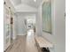 Bright hallway with modern art, leading to an open-concept living area and sliding barn doors at 1901 Kansas Ne Ave, St Petersburg, FL 33703
