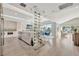 Open concept kitchen with modern appliances, wine rack, dining area, and view of the waterfront at 1901 Kansas Ne Ave, St Petersburg, FL 33703