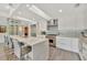 Bright kitchen with skylight includes an island, quartz countertops, and a wine rack at 1901 Kansas Ne Ave, St Petersburg, FL 33703