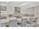 Modern kitchen features white cabinetry, mosaic backsplash, and stainless steel appliances at 1901 Kansas Ne Ave, St Petersburg, FL 33703