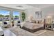 Serene main bedroom features large windows, water views, and stylish decor at 1901 Kansas Ne Ave, St Petersburg, FL 33703