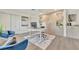 Well-lit office with a contemporary desk setup, comfortable blue armchairs, and custom cabinetry at 1901 Kansas Ne Ave, St Petersburg, FL 33703