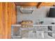 Covered outdoor kitchen features stainless steel grill and appliances, perfect for backyard entertaining at 1901 Kansas Ne Ave, St Petersburg, FL 33703