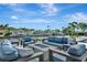 Comfortable waterfront patio with plush seating, fire pit, and scenic views for relaxing and entertaining at 1901 Kansas Ne Ave, St Petersburg, FL 33703