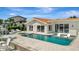 Stunning waterfront pool featuring built-in seating and an expansive patio ideal for relaxing and entertaining at 1901 Kansas Ne Ave, St Petersburg, FL 33703