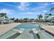 Inviting pool with relaxing sun loungers in the shallow end, perfect for enjoying waterfront views at 1901 Kansas Ne Ave, St Petersburg, FL 33703