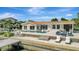 Beautiful waterfront pool with built-in loungers and an expansive patio for relaxing and entertaining by the water at 1901 Kansas Ne Ave, St Petersburg, FL 33703