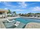Luxury waterfront pool with built-in chaise loungers, offering stunning views of the canal and surrounding landscape at 1901 Kansas Ne Ave, St Petersburg, FL 33703